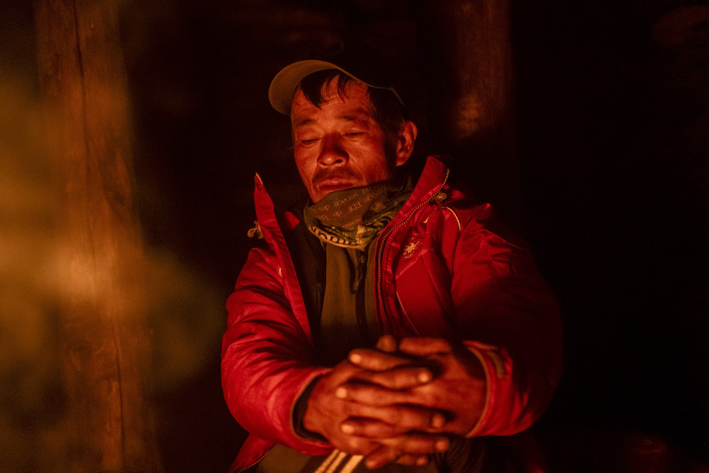 A local guide inside a shed in Machet Kharka. Photo: Amir Shrestha