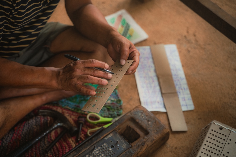 Intricate Dhaka patterns taking shape, woven with skill, patience, and tradition.